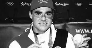 Baseball player wearing a Sydney 2000 medal.