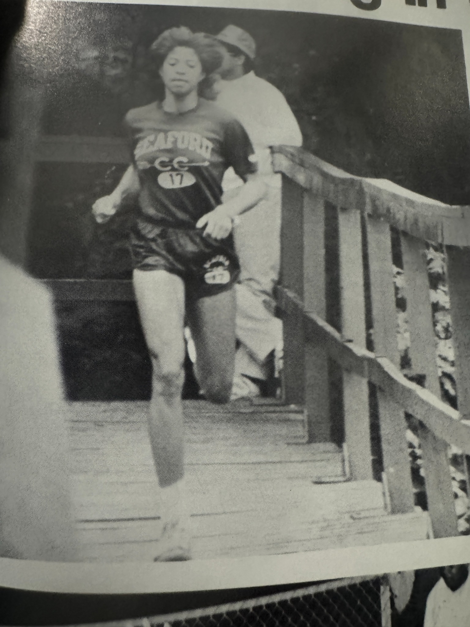 A runner wearing a Seaford cross-country shirt.