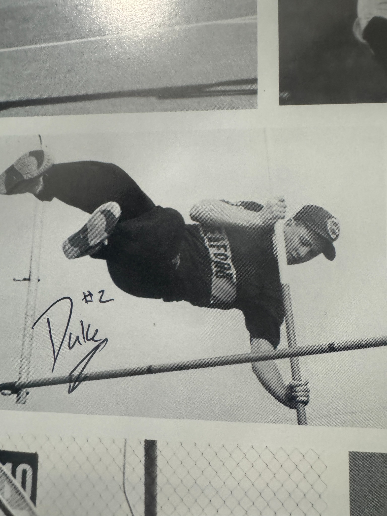 Seaford track and field athlete over a bar in a yearbook photograph.